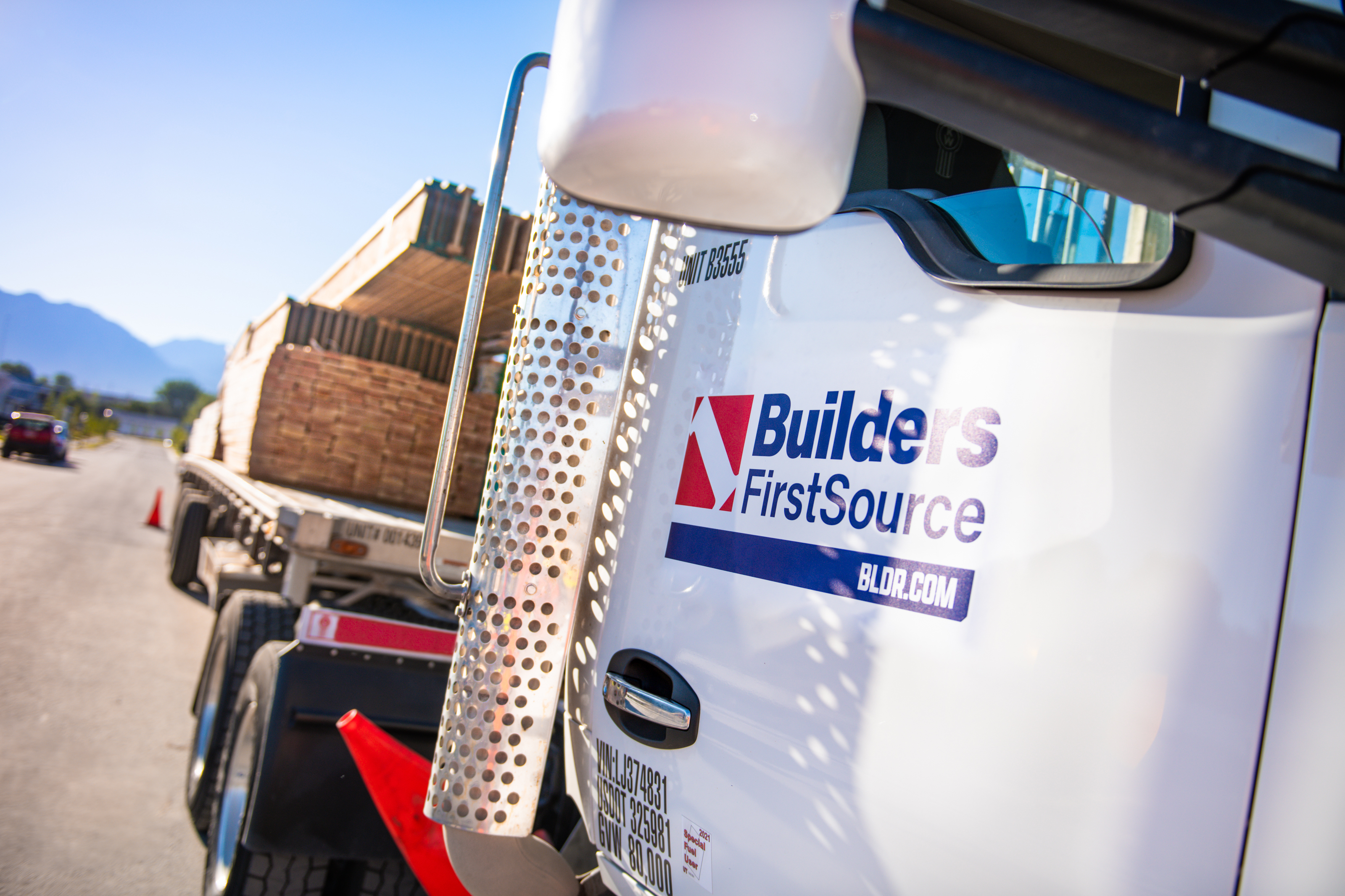 Builders FirstSource delivery truck carrying building materials