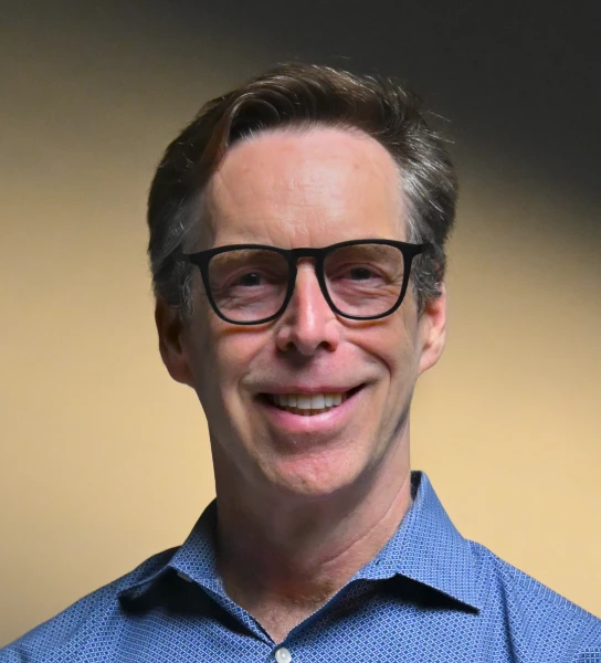 Peter Mullen Learned Endurance in the Water. Now He Markets AI in a Sea of Noise.