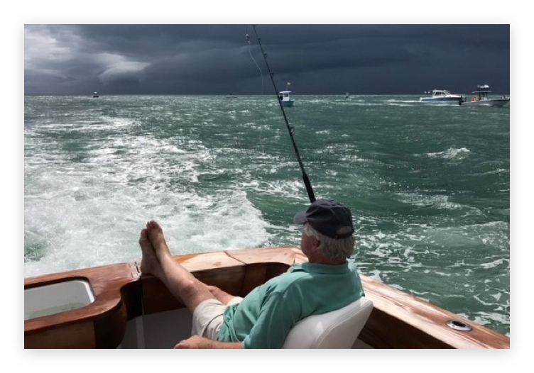 Peter Nicholas fishing aboard his boat