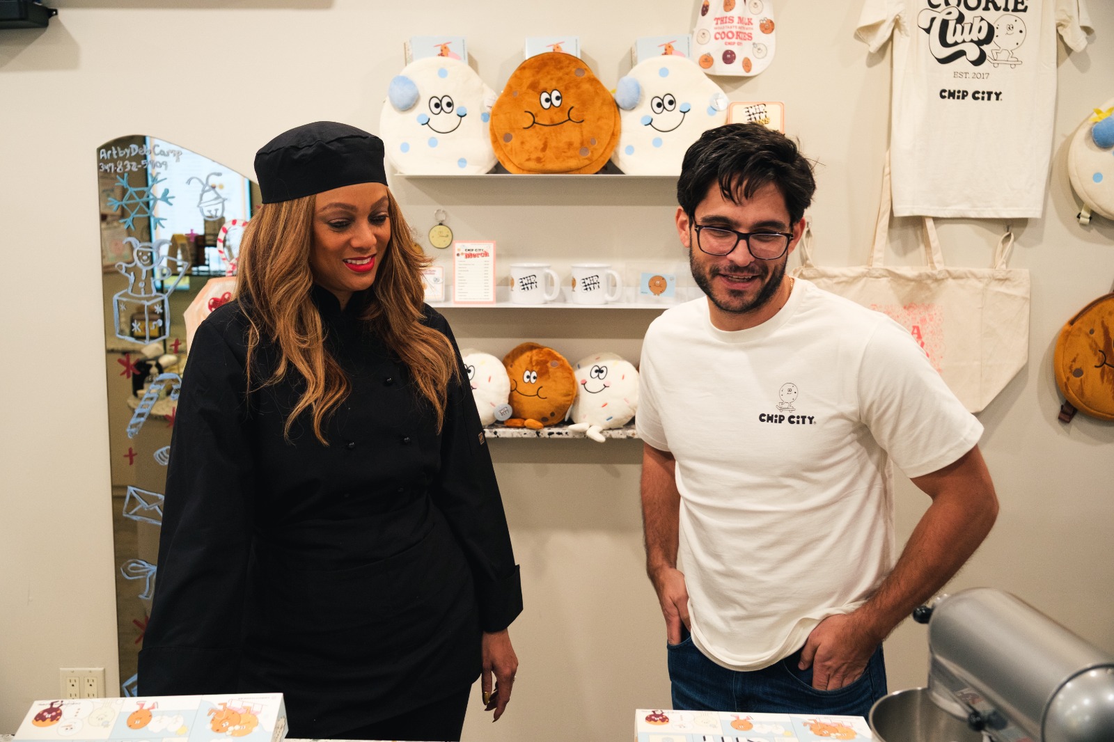 Tyra Banks and Peter Phillips together inside a Chip City shop