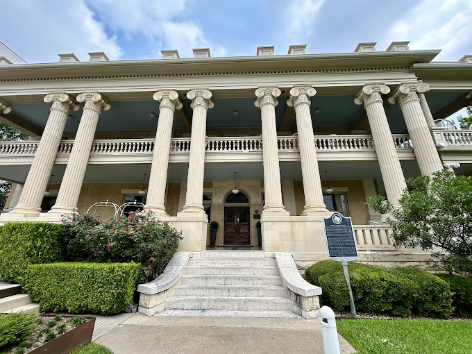 The historic white-columned mansion at Hotel Ella in Austin