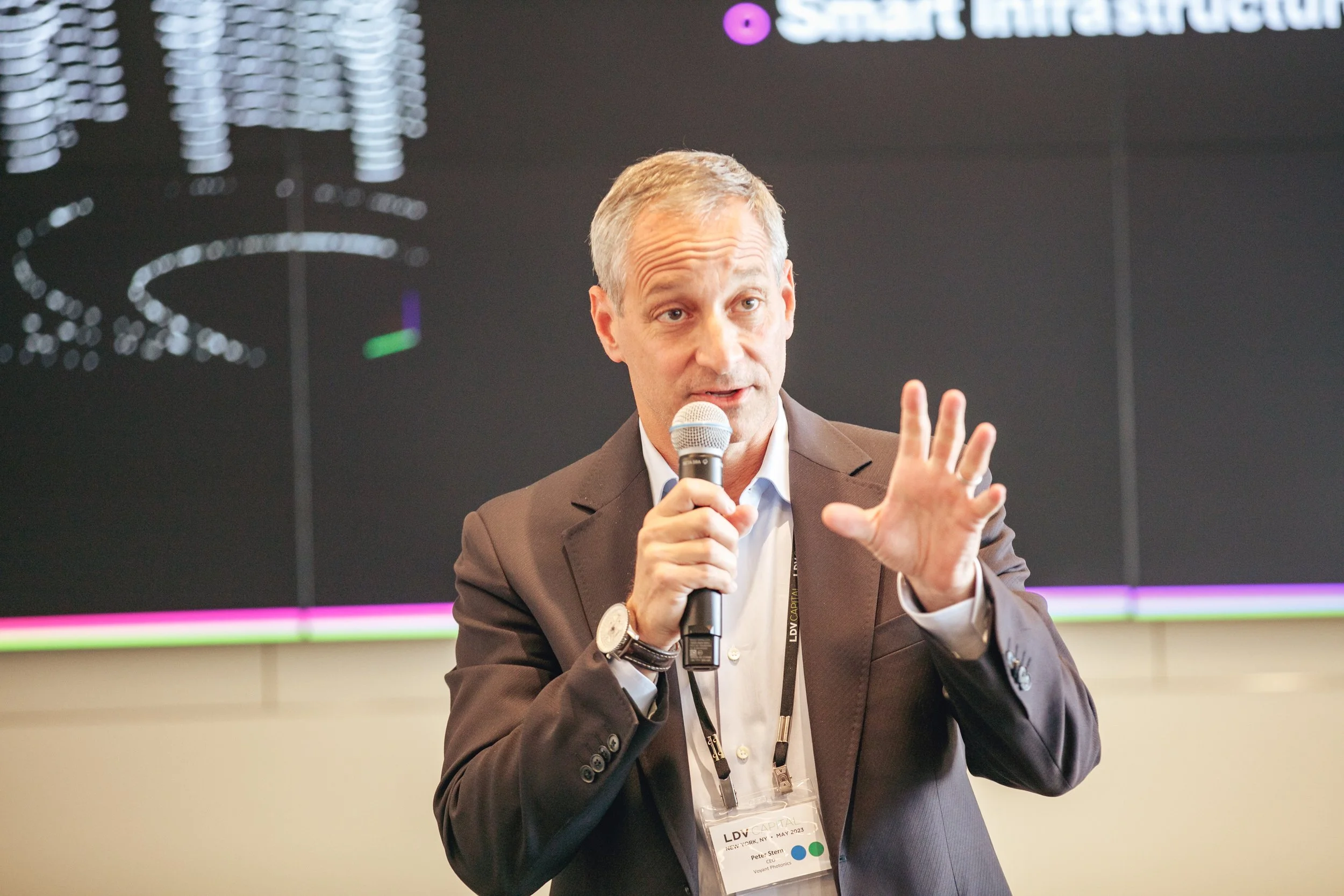 Peter Stern speaking with a microphone at LDV Capital’s 2023 meeting
