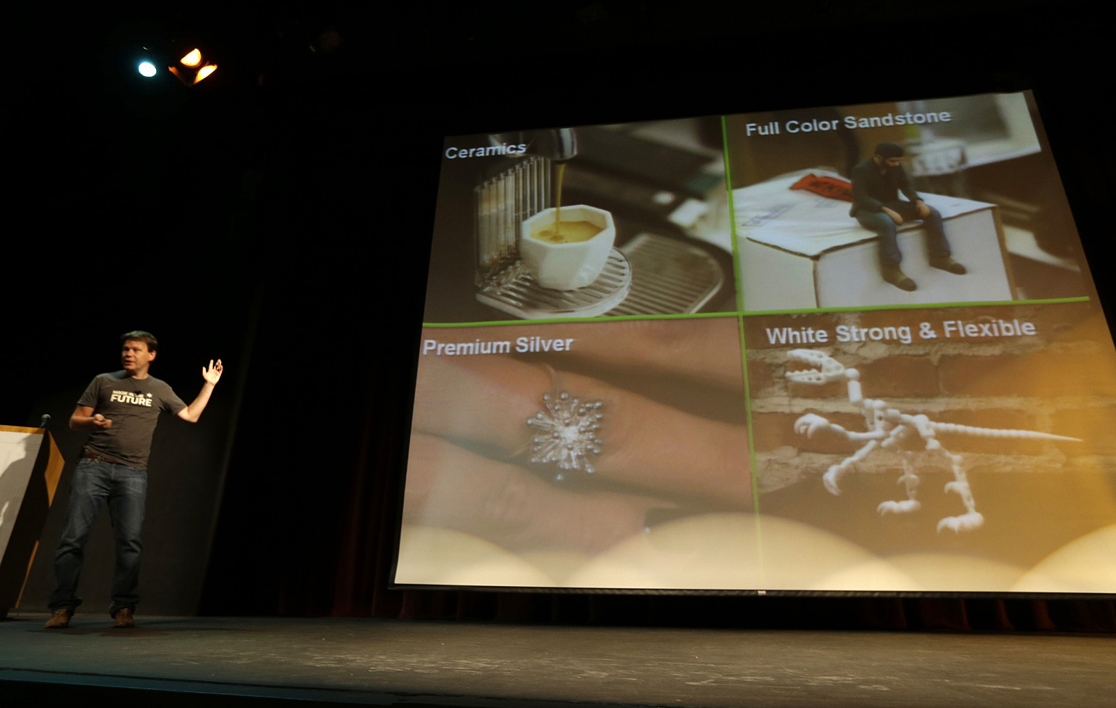 Peter Weijmarshausen on stage beside examples of 3D printed objects