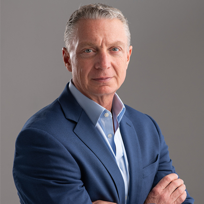 Petra Coach founder Andy Bailey in a blue suit
