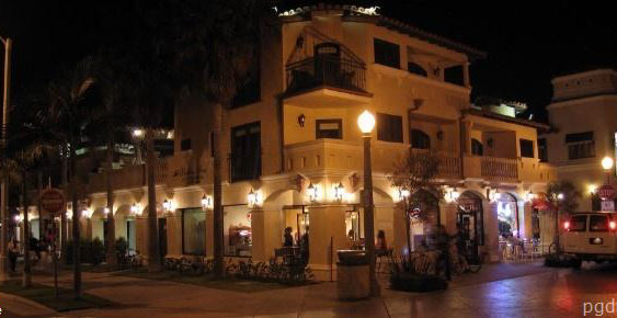 Balboa Inn at night, with illuminated arches and a streetlamp at the corner