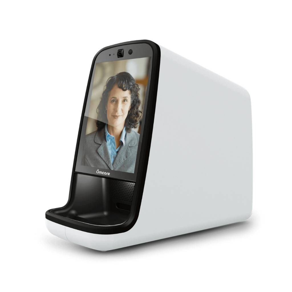Ōmcare Home Health Hub with touchscreen and a medication pouch in the dispensing tray