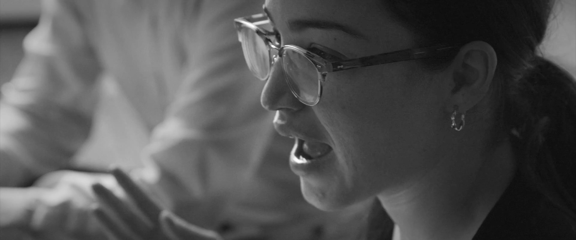 A Phase 5 team member in a black-and-white still from the company's culture film