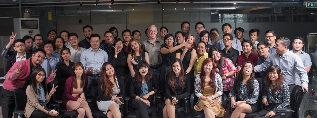 Phil Bartos standing with the NarraSoft team in Manila, in a group photograph shared in 2017