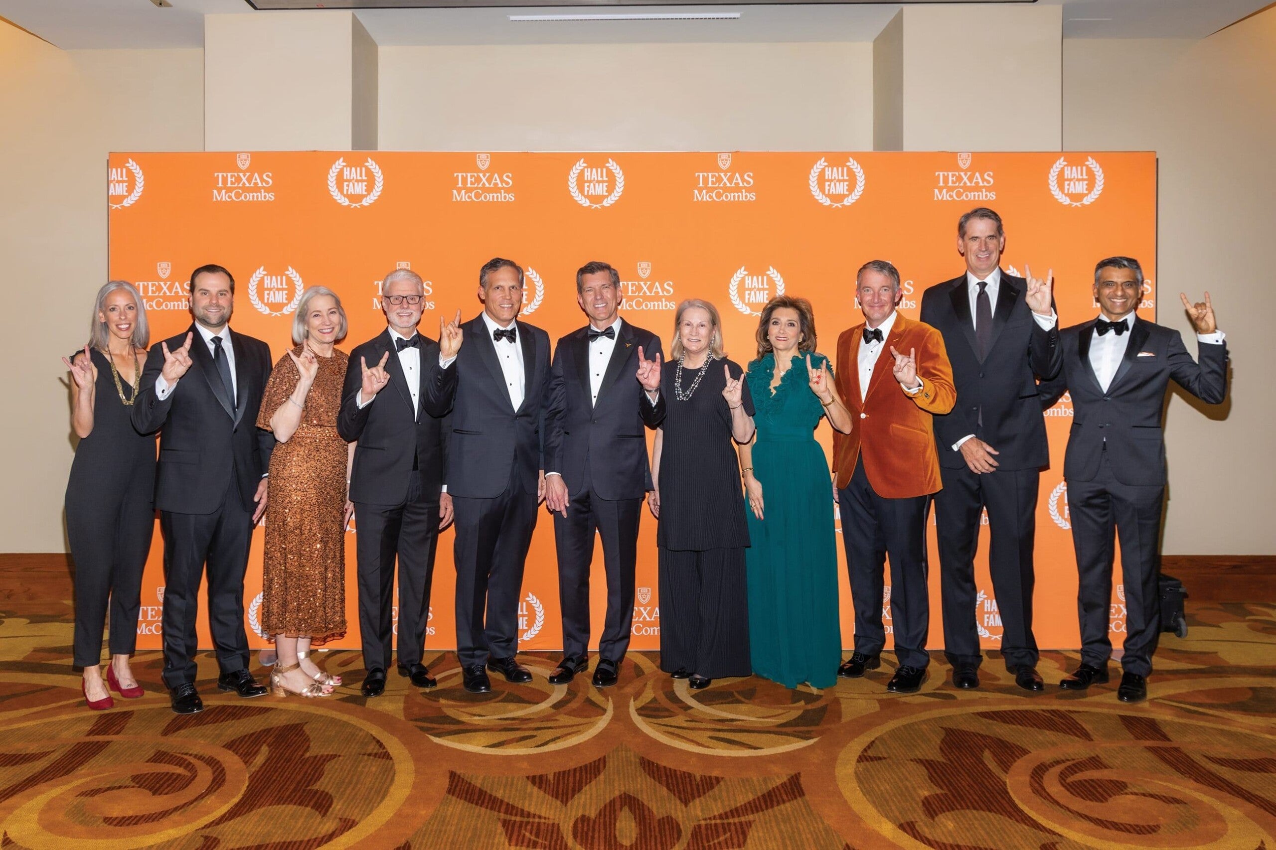 Phil Green, fourth from left, with fellow honorees and university leaders at the 2023 Texas McCombs Hall of Fame celebration