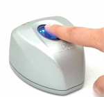 A finger resting on a Lumidigm fingerprint sensor