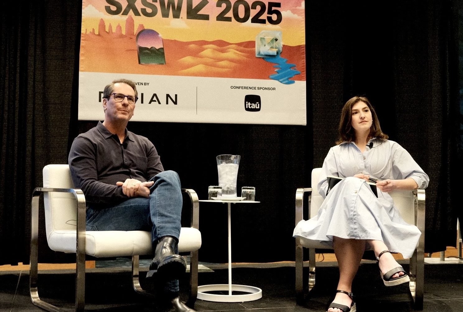 Philip Moyer seated beside Fortune interviewer Kristin Stoller onstage at SXSW 2025