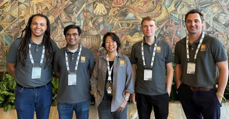 Philipp Herget with four Dusty Robotics colleagues at an industry event
