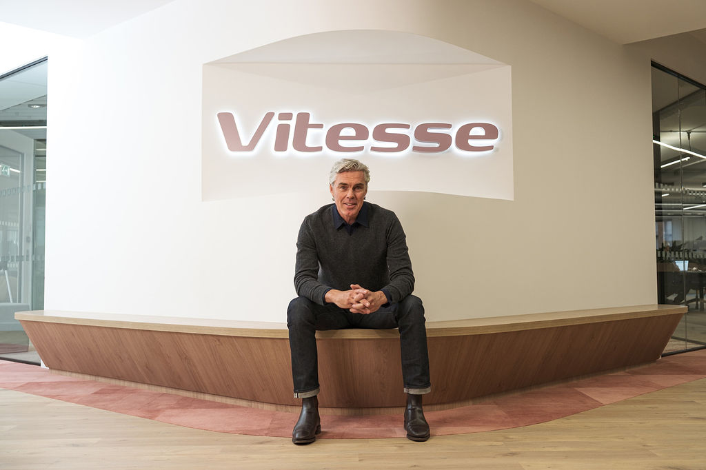 Phillip McGriskin seated beneath the Vitesse sign in the company’s office
