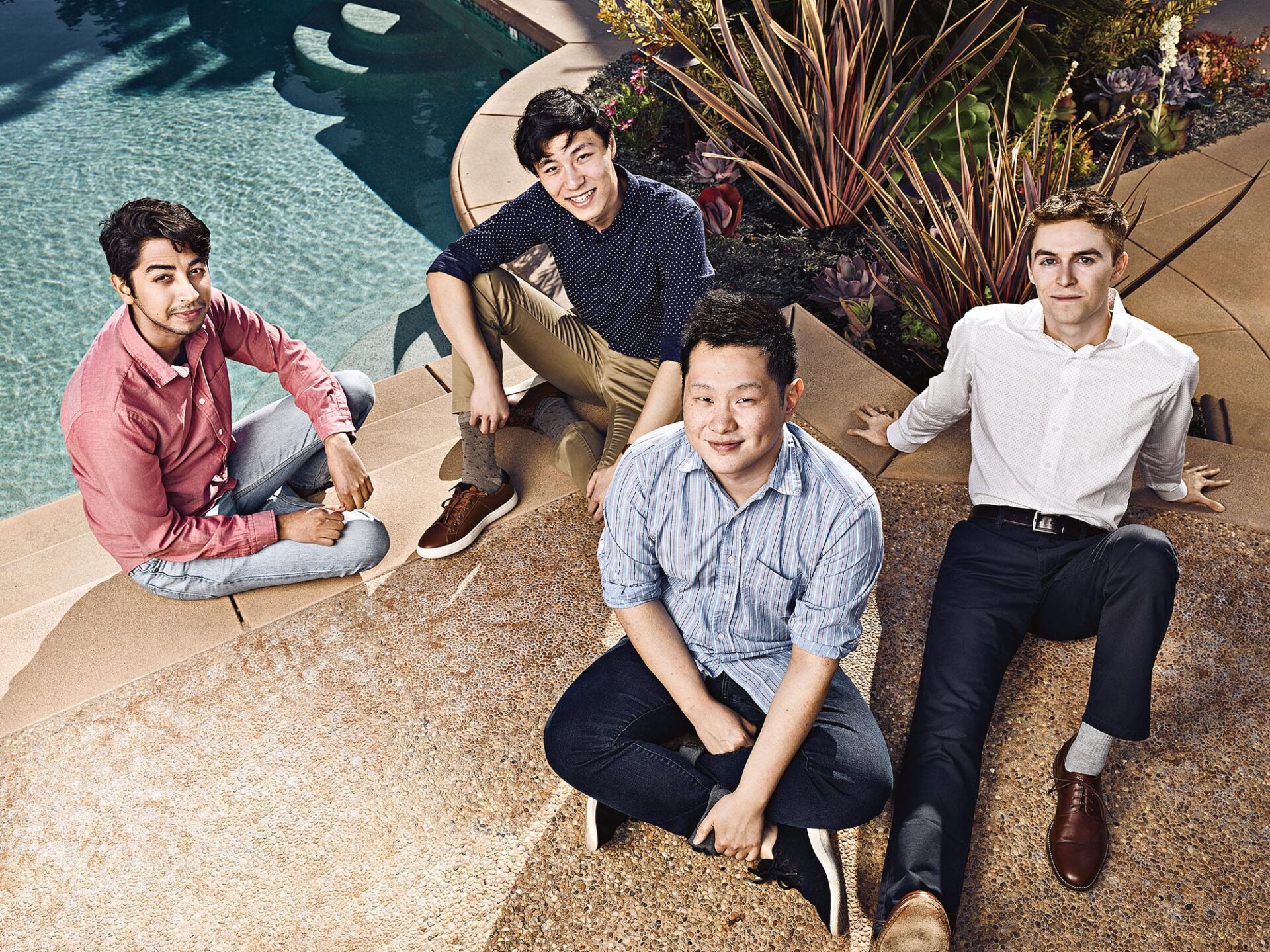 Gather co-founders Kumail Jaffer, Alex Chen, Phillip Wang and Nate Foss sitting beside a pool