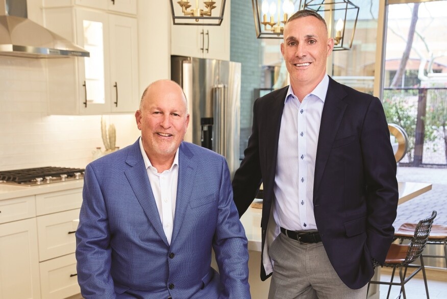 Meritage founder Steven Hilton and CEO Phillippe Lord pictured together in a model kitchen