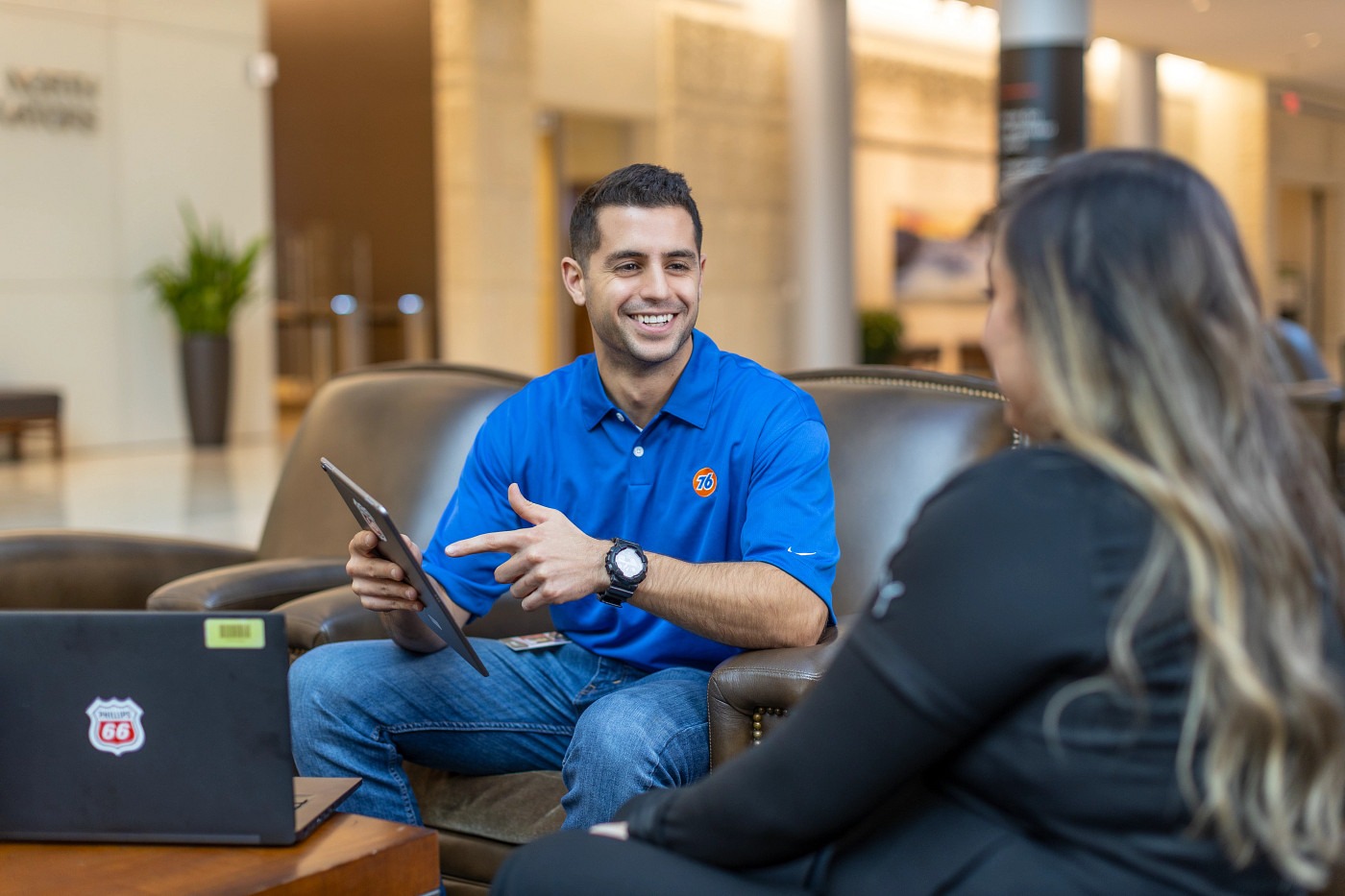 Phillips 66 employees talking at the company's headquarters