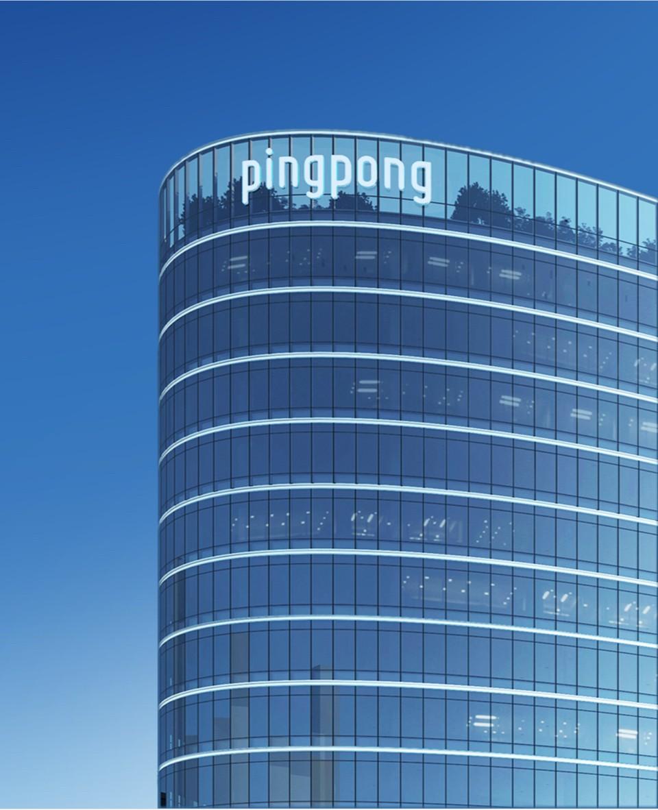 Glass-fronted PingPong company building with its name mounted near the roof