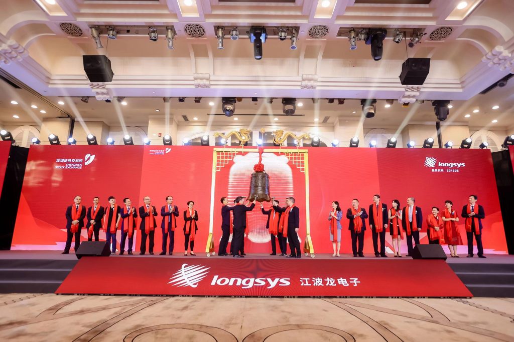 Longsys representatives at a ceremony on a red stage, pictured in PIO’s Longsys customer story