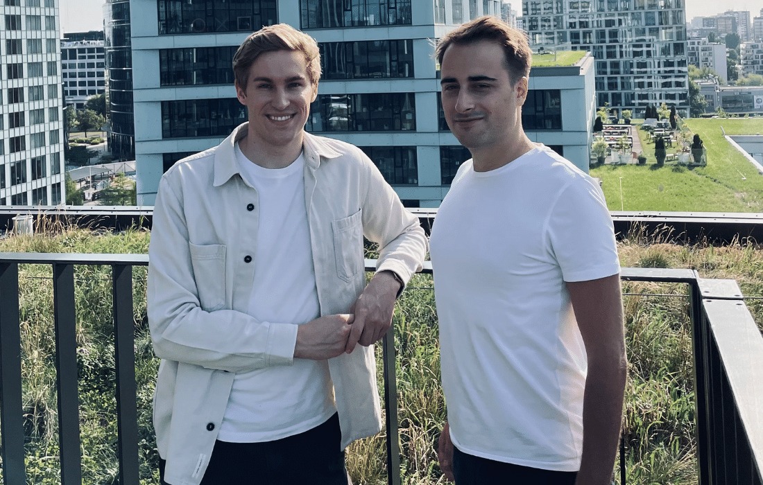 Mati Staniszewski at left and Piotr Dabkowski at right standing together outdoors