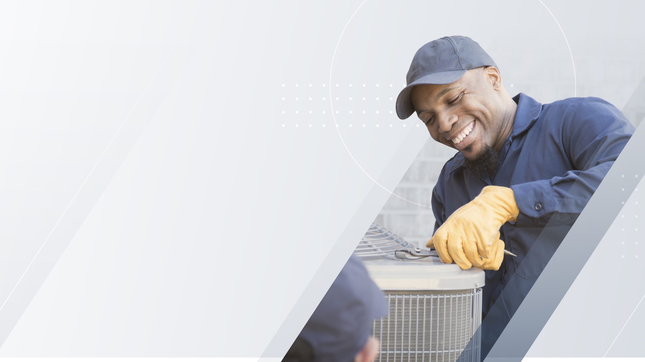 An HVAC technician working beside an outdoor air-conditioning unit, in a PipeDreams website photograph