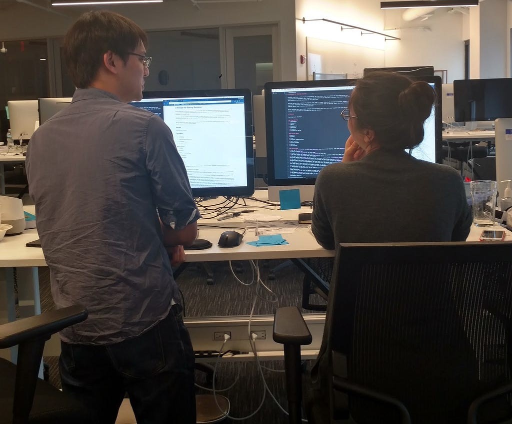 Pivotal Labs engineers pairing at a workstation