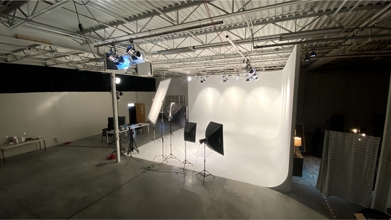 True North Stage production studio with a large white cyclorama and lighting equipment