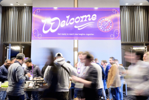 People gathering at a Planful event, from the company’s workplace gallery