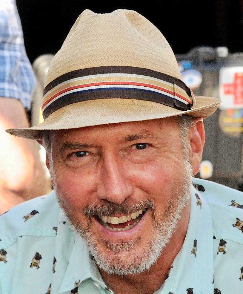 PMG founder Henry Eshelman smiling in a straw hat