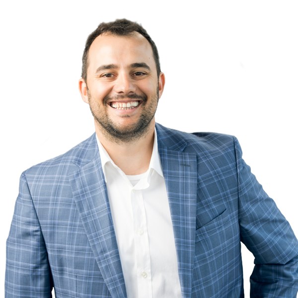 PMG founder and CEO George Popstefanov smiling in a blue checked jacket