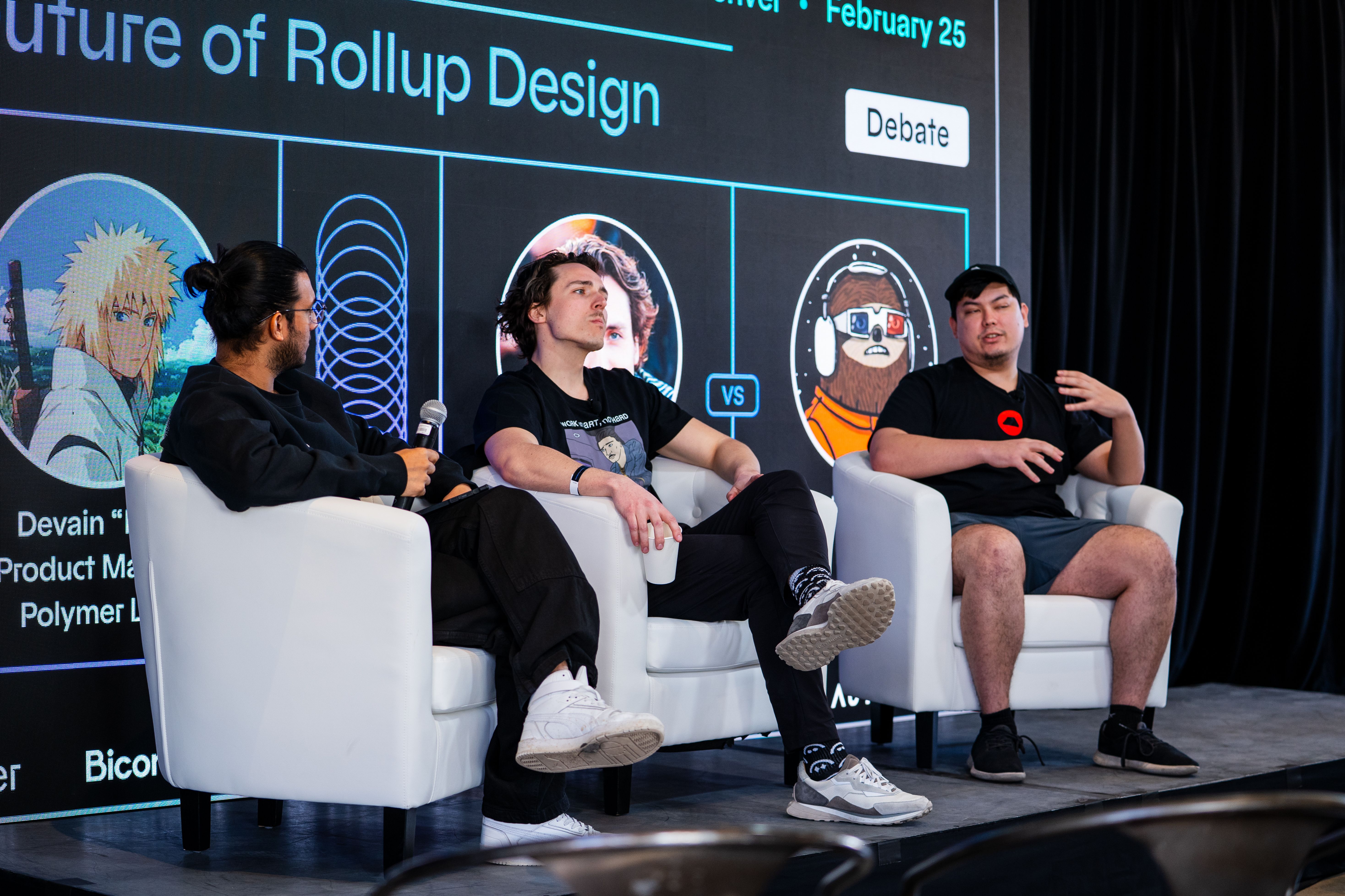 Panelists seated onstage beneath a Future of Rollup Design presentation