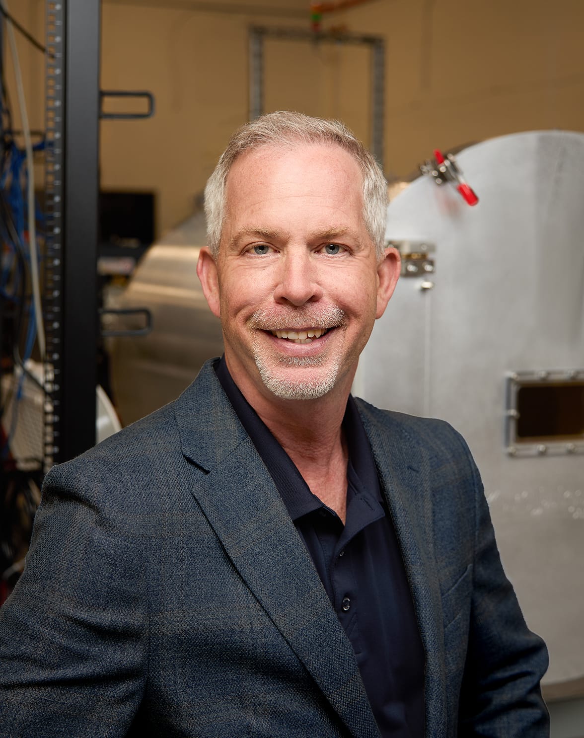 Portal Space Systems CEO Jeff Thornburg in a spacecraft test facility