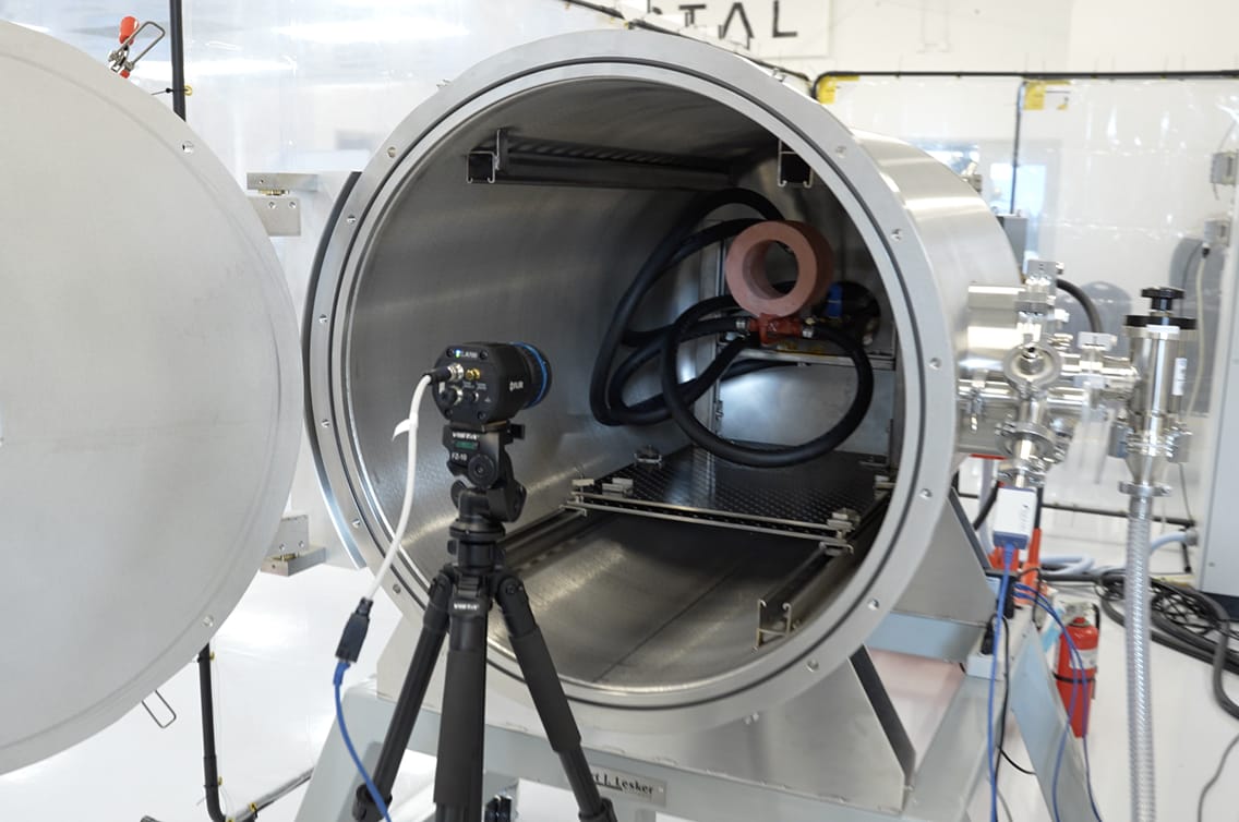 Portal thermal-vacuum test chamber with test hardware and camera