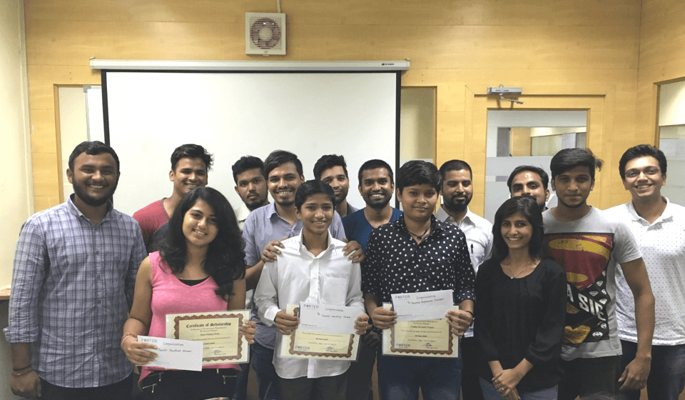 A group of Porter team members posing with certificates