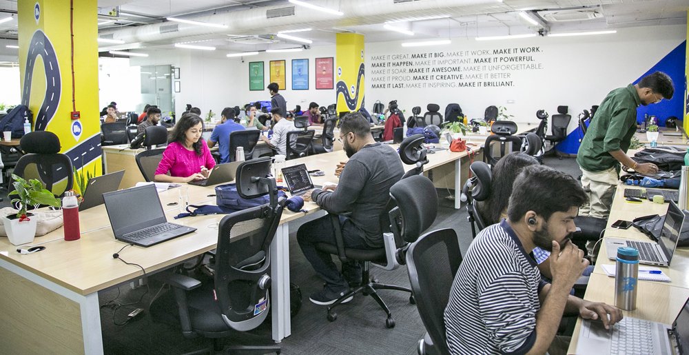 Porter employees working at desks in an open-plan office