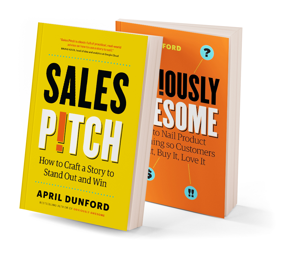 Yellow Sales Pitch book beside the orange original edition of Obviously Awesome