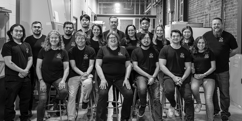 The Pow.Bio team standing together outdoors