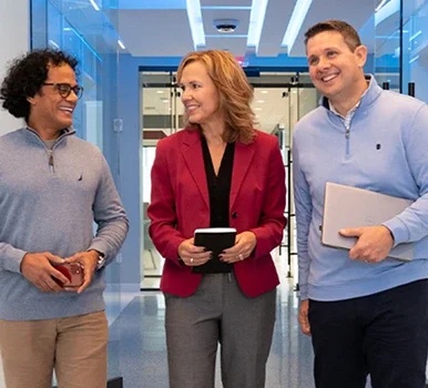 PPG coworkers standing together in a hallway