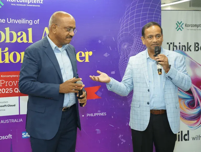 Prakash Anthony speaking with a microphone at the unveiling of Korcomptenz’s Global AI Innovation Center