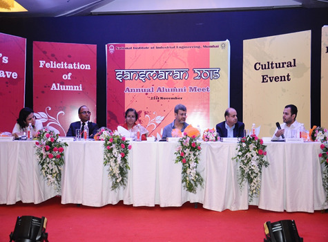 Panelists seated onstage during NITIE's Sansmaran 2015 alumni gathering