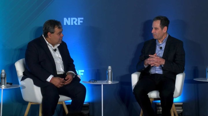 Prashant Agrawal, left, in conversation with Ben Pivar on the NRF stage in 2024