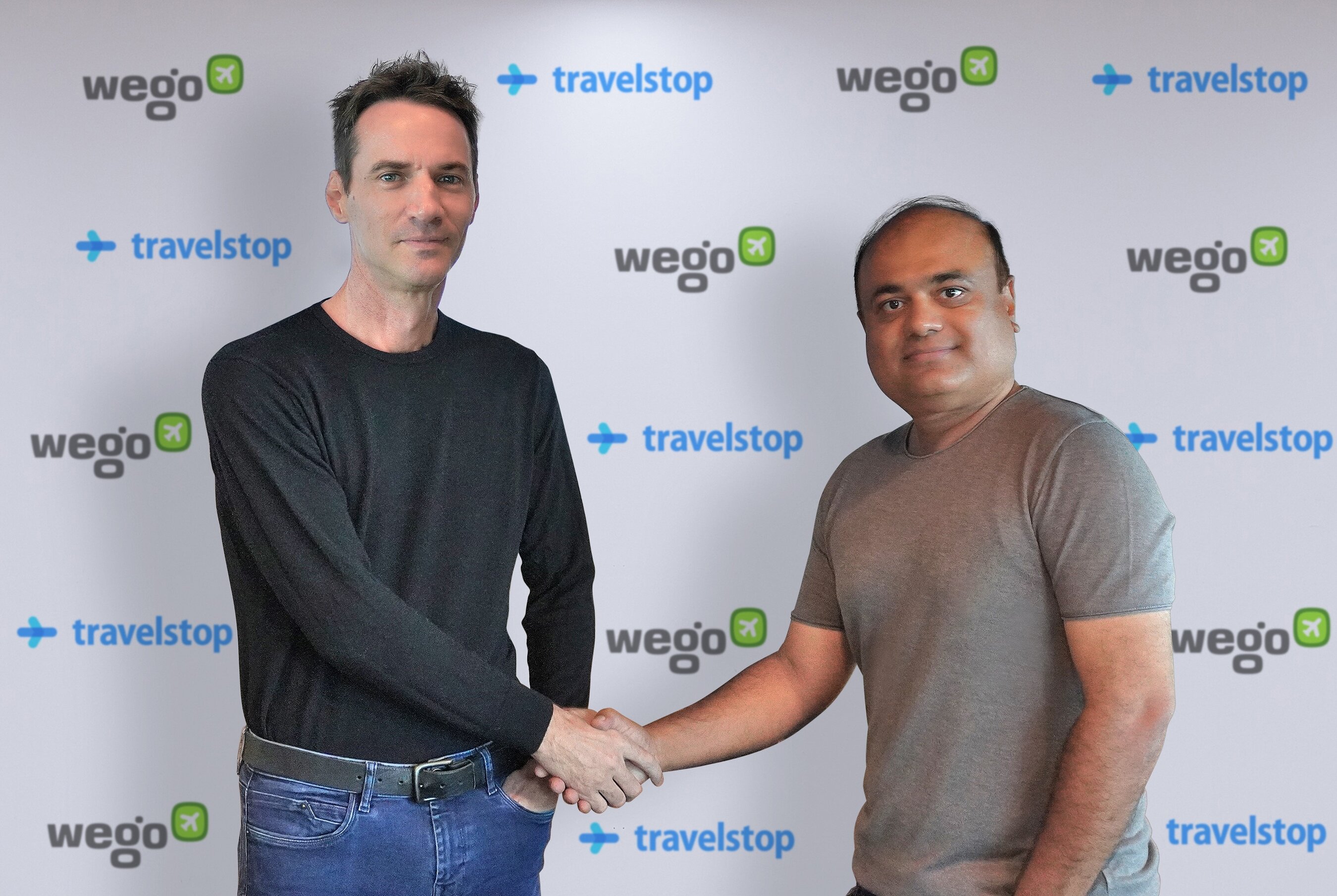 Ross Veitch on the left and Prashant Kirtane on the right shaking hands at the Wego and Travelstop acquisition announcement