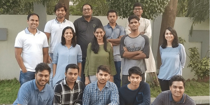 Prashant Warier, Pooja Rao and members of Qure.ai’s early team outdoors