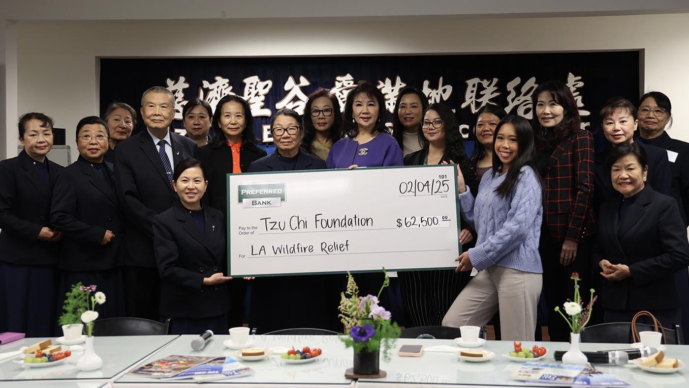 Preferred Bank representatives and Tzu Chi volunteers gather for a wildfire-relief donation presentation