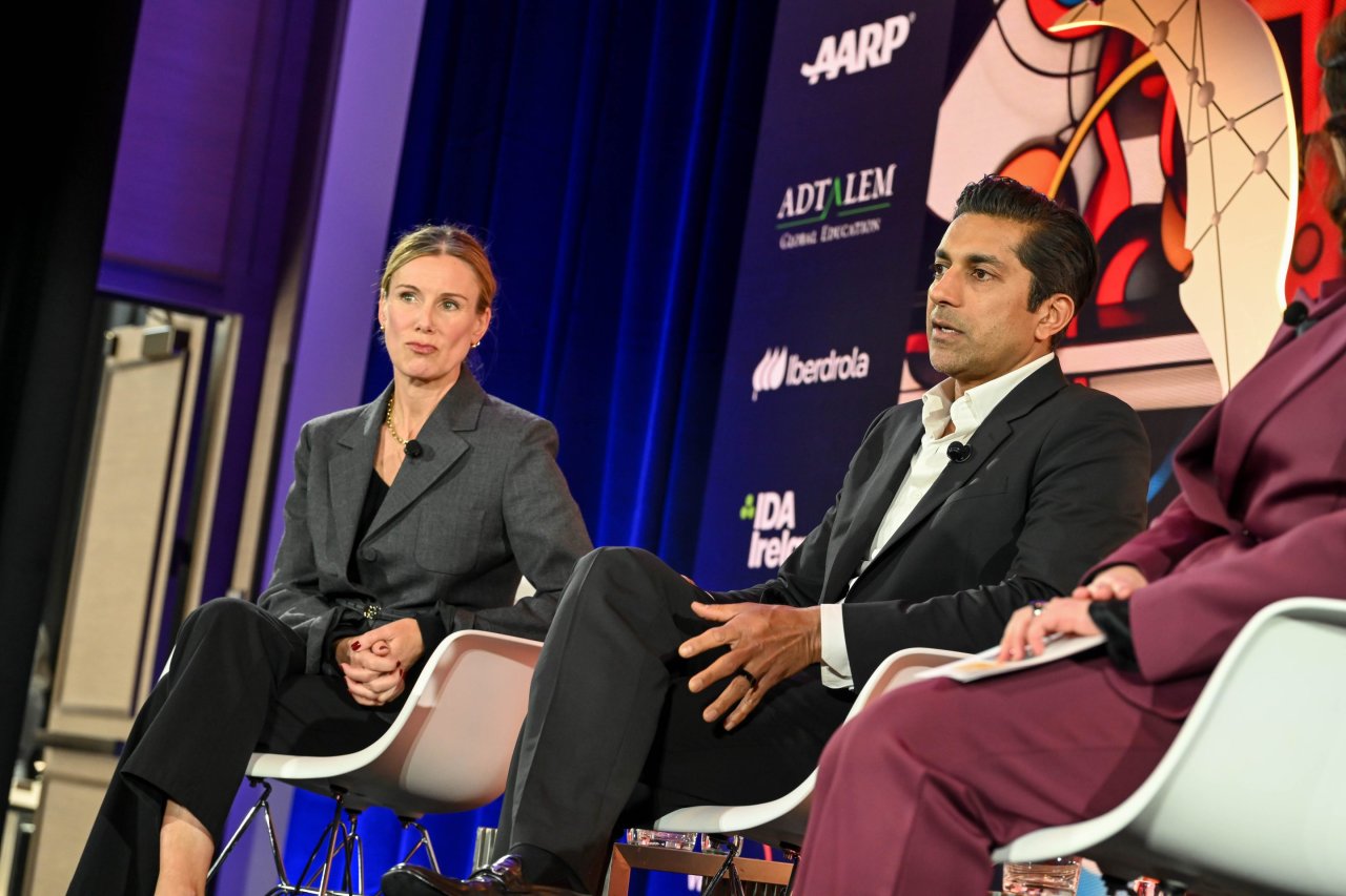 Prem Akkaraju speaking onstage beside Greycroft co-founder Dana Settle at Fortune Brainstorm AI in 2024