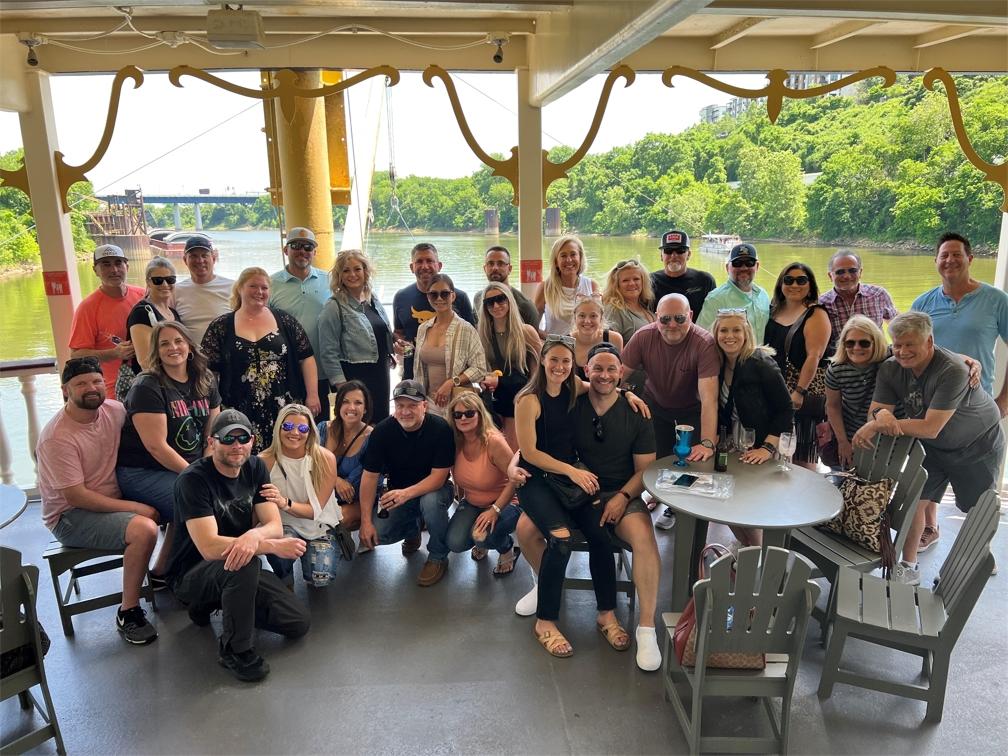 A group pictured aboard a boat in PMR's company photo gallery