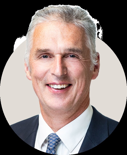 Preqin co-founder Mark O’Hare smiling in a suit and tie