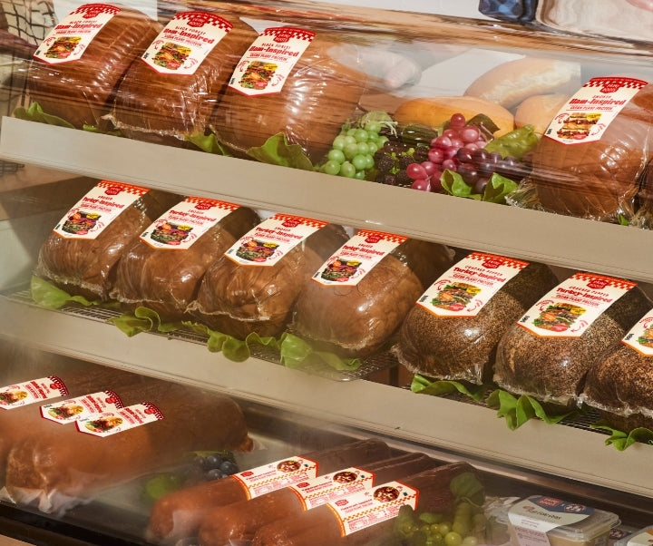Prime Roots bulk animal-free deli meats displayed in a refrigerated deli case