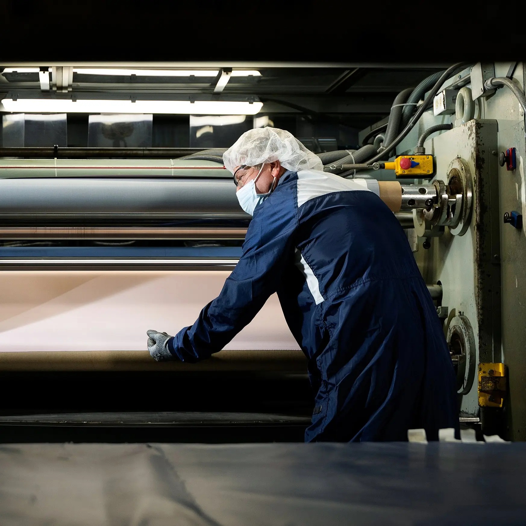 Camden Copper employee tending copper-foil production equipment