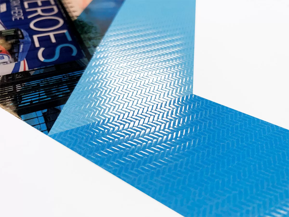 Close view of Riverside Transit Agency annual report showing a glossy herringbone pattern and cover photography