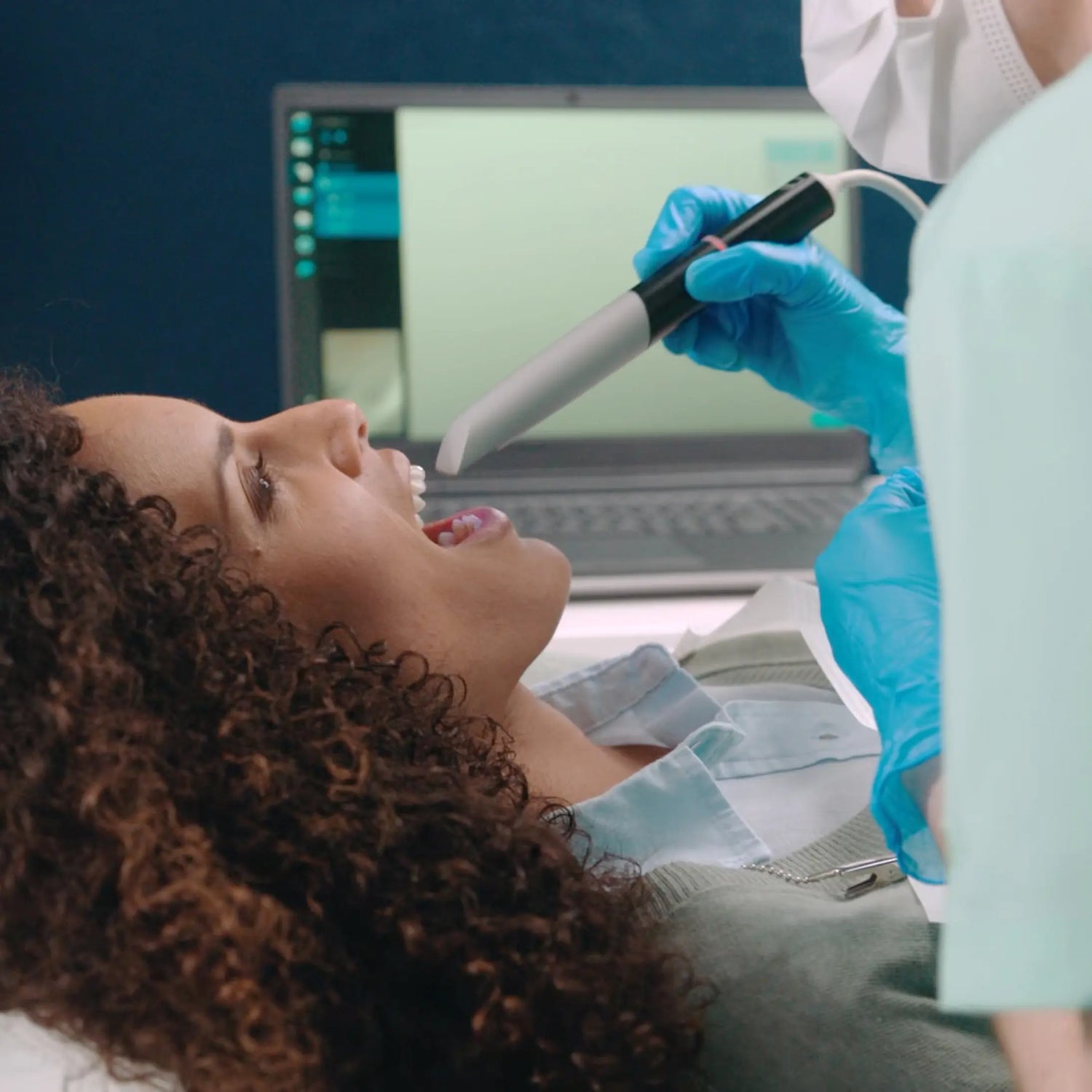 A patient receives a digital oral scan for a Proclaim mouthpiece
